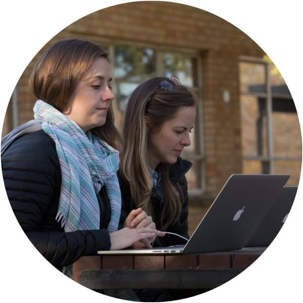 A woman working on her laptop.