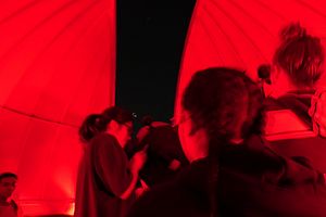 A group of students using the telescope.