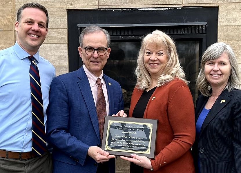 Dorita Tessier receiving the community service award from John McVay
