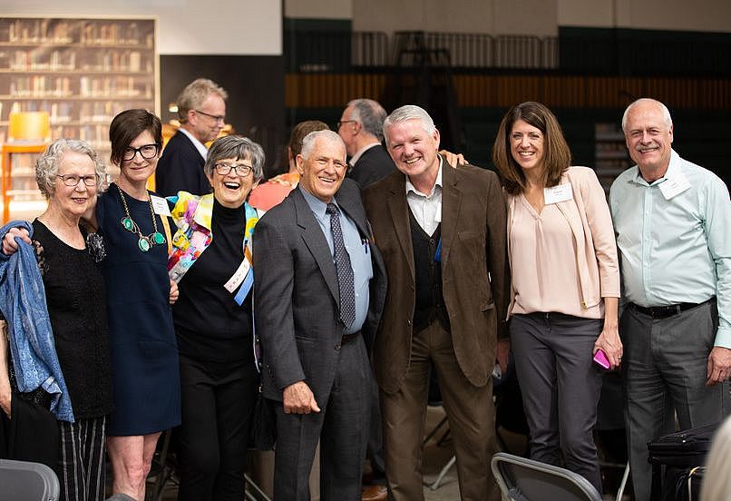 A group of alumni gather for a photo during homecoming weekend 2019.