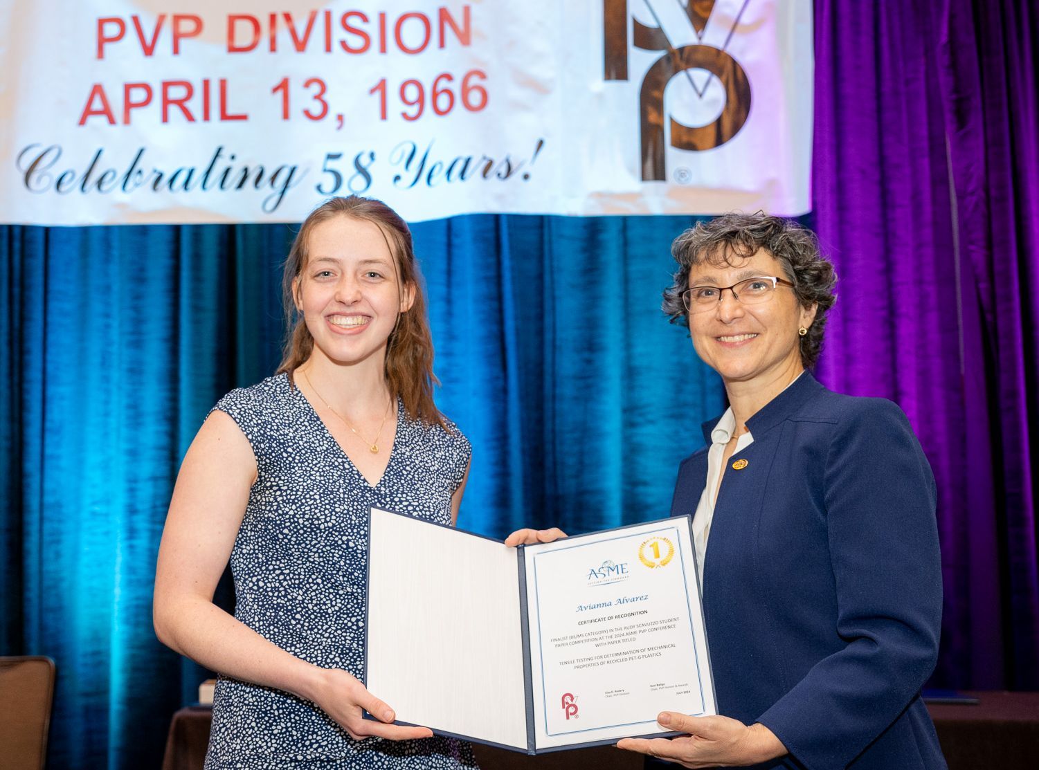 Avianna Alvarez receiving the Outstanding Student Paper award at the PVP conference