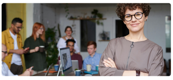 A leader stands in front of team