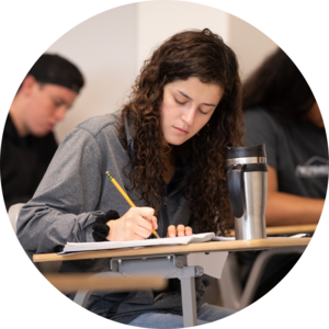 A student taking notes in class.