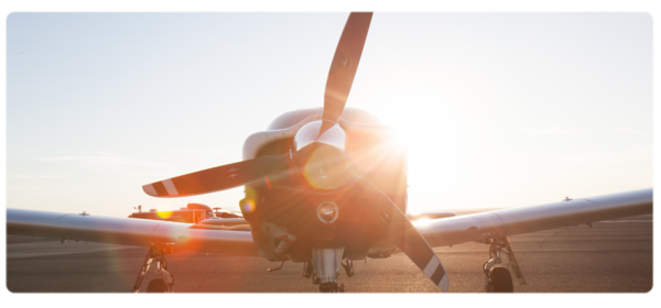 Airplane with sun shining from the back