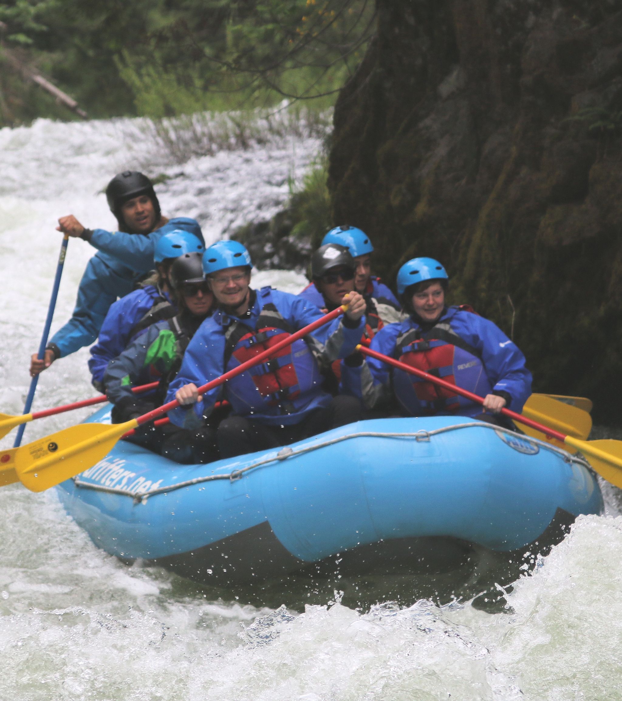 WWU students are all smiles as they crash through foaming waves on the White Salmon River.