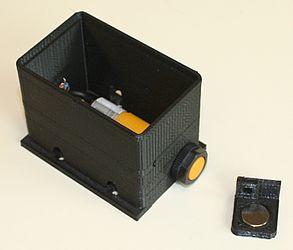 The sensor switch attached to the housing.