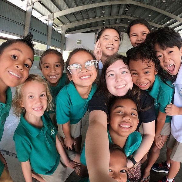 teacher with happy students