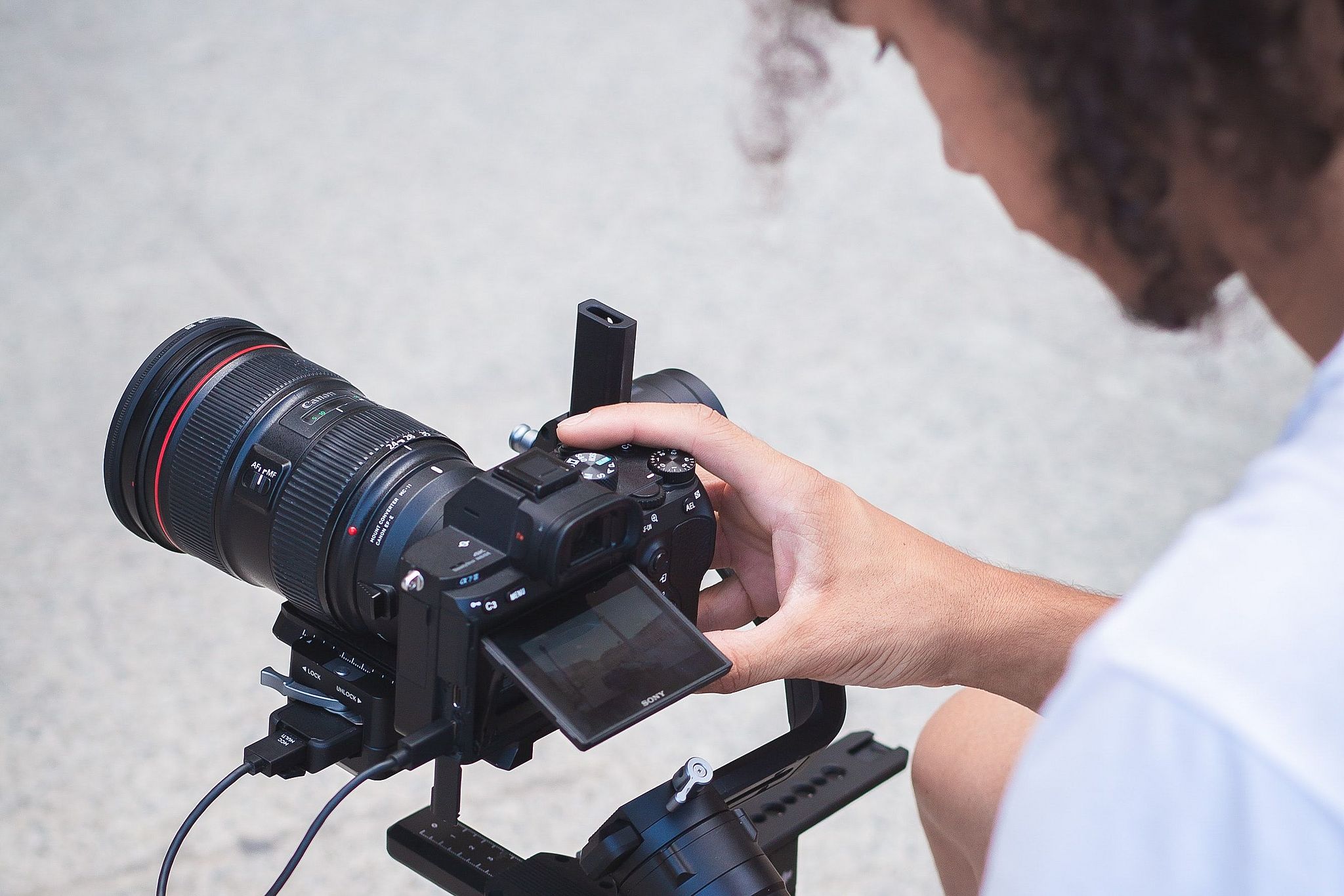 Student works on film camera.