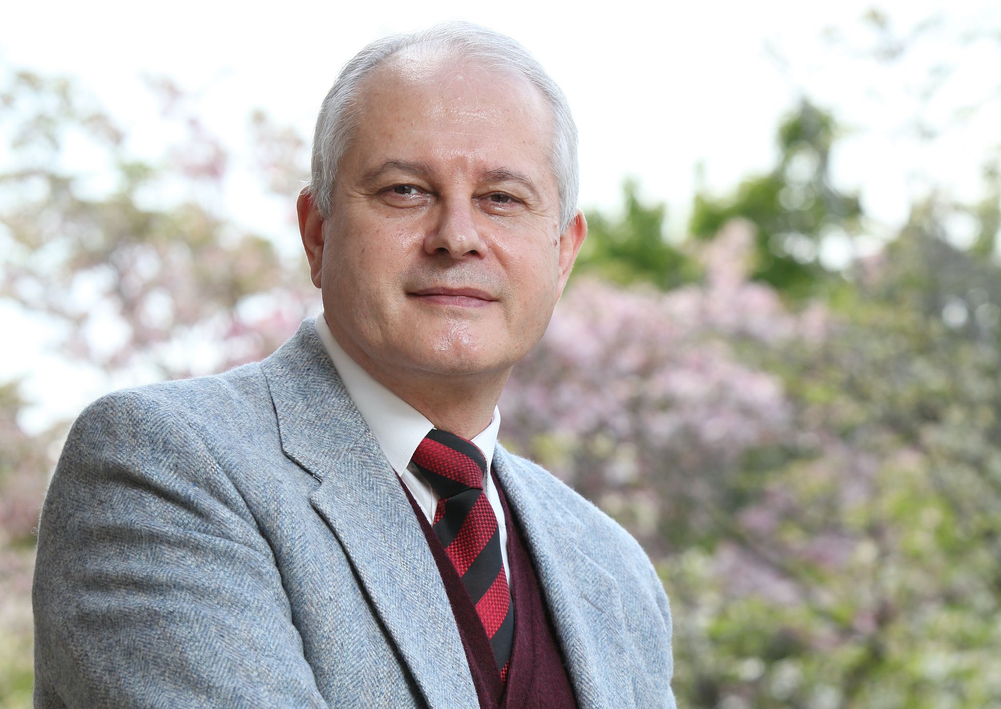 Professional Portrait of Mihail Motzev standing outside. 