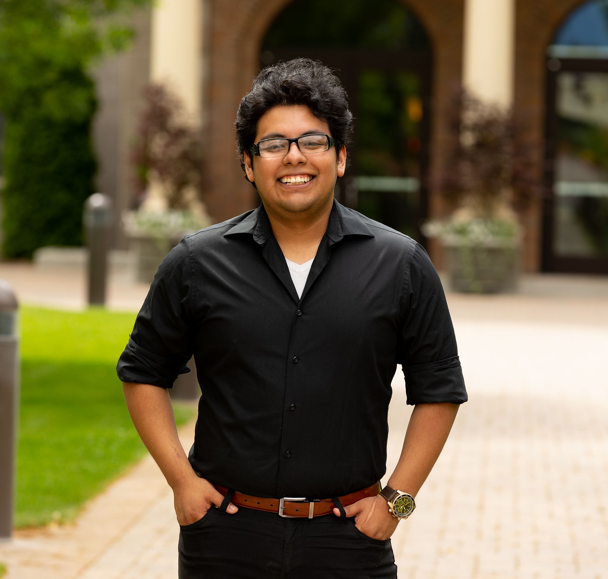 Dennis Herrera standing on the sidewalk in front of the WWU Administration Building.