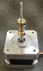 Stepper motor with coupling to threaded rod.