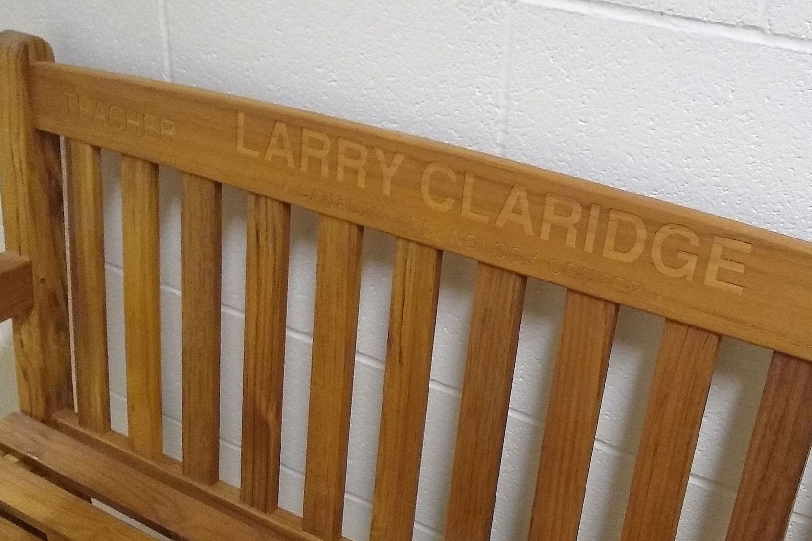 Wooden bench with inscription saying 